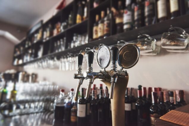 ready to pint of beer on a bar in a traditional style wooden pub