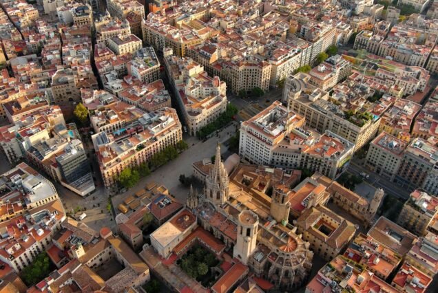 Aerial view of Barcelona skyline with Barcelona Cathedral and Gothic Quarter at sunrise