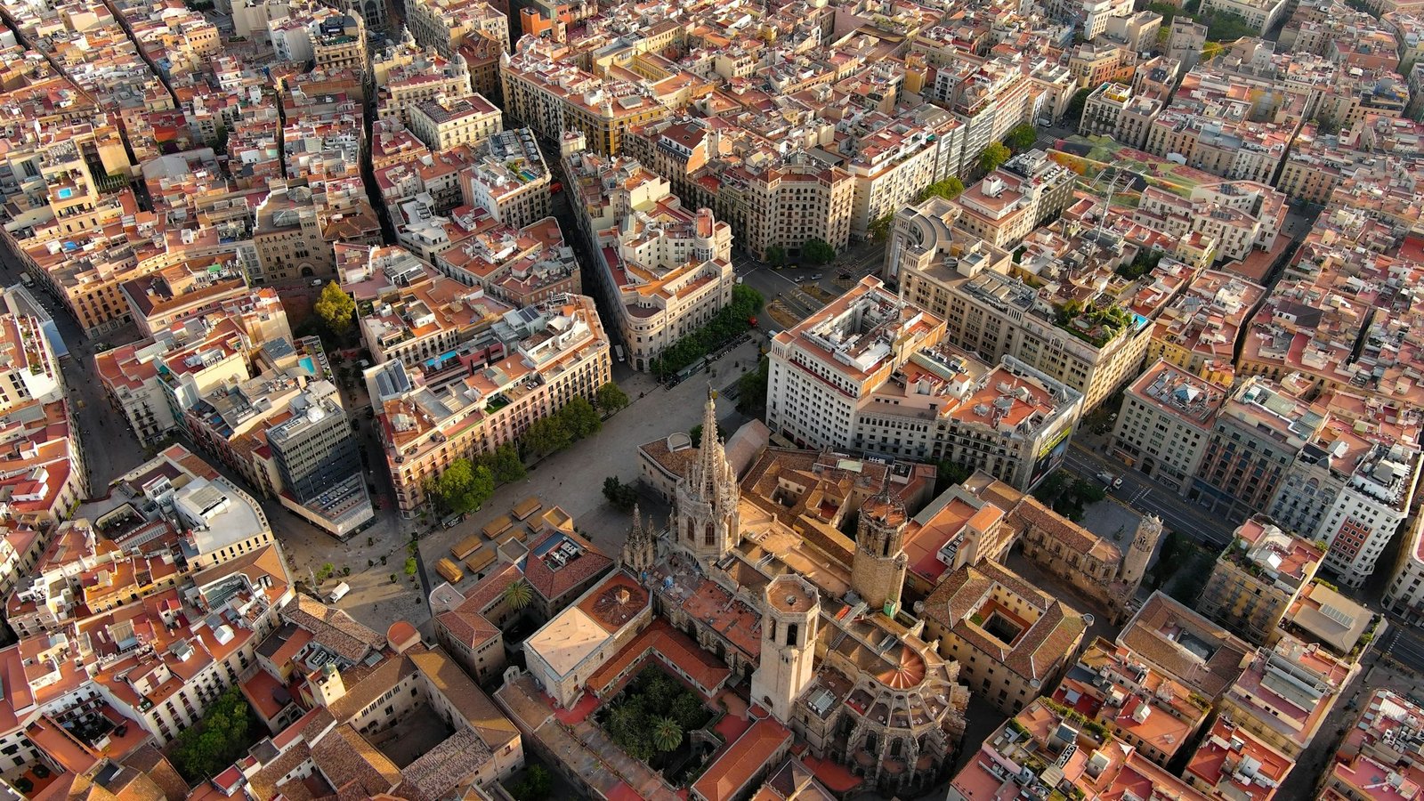 Aerial view of Barcelona skyline with Barcelona Cathedral and Gothic Quarter at sunrise
