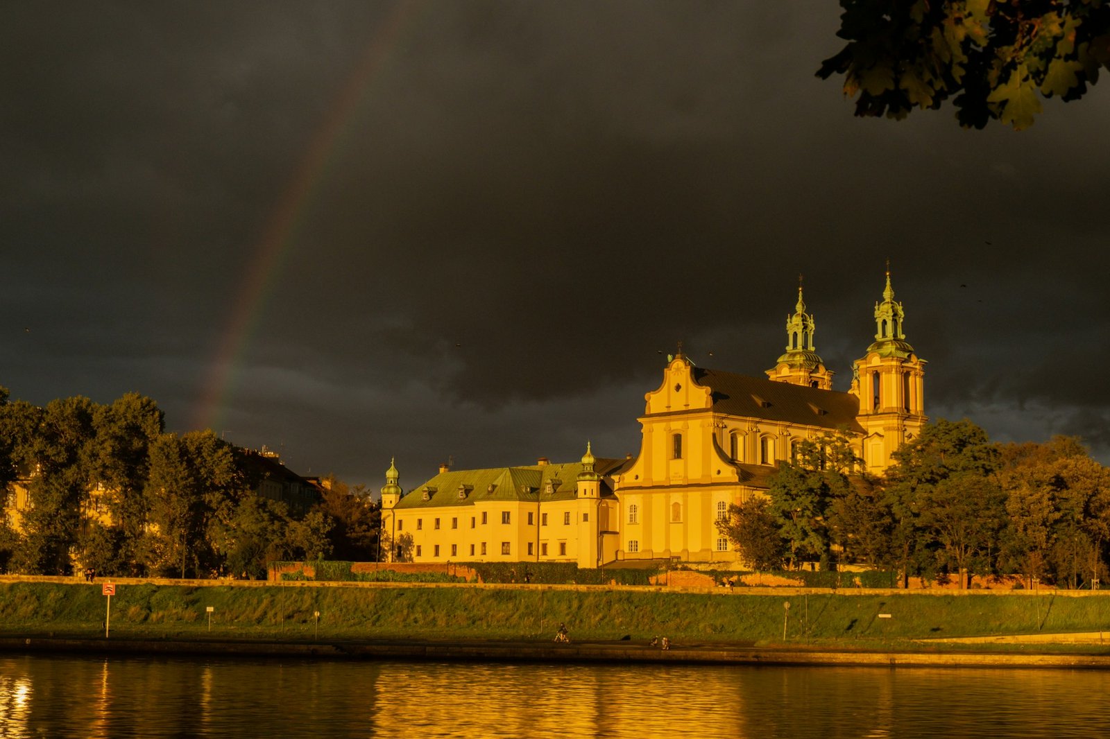 Heavy rain and rainbow above the Vistula river in Krakow Poland. Stunning views of the city rainy