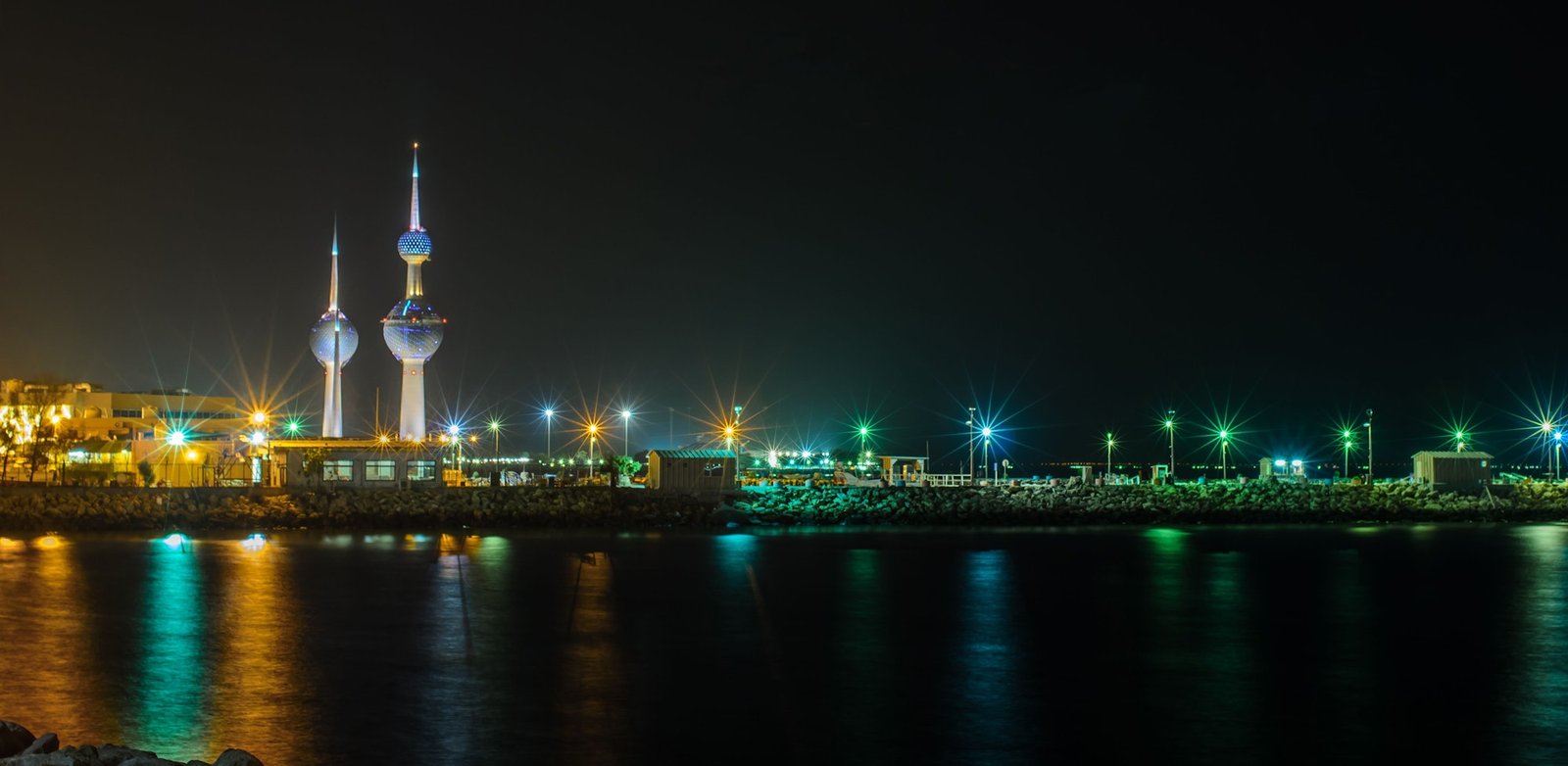 Illuminated night view of Kuwait city and famous towers