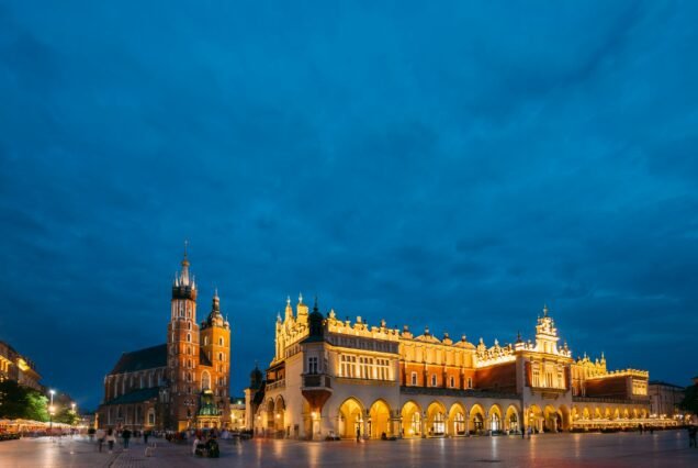 Krakow, Poland. Evening Night View Of St. Mary's Basilica And Cl