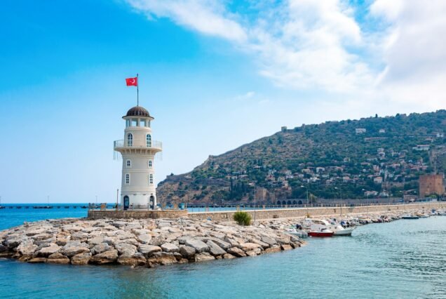 Panoramic view of old lighthouse in Alanya port. Landscape view of Mediterranean coast, Alanya