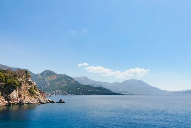 Top view Montenegro Sutomore stones beach blue turquoise Adriatic sea water mountains day