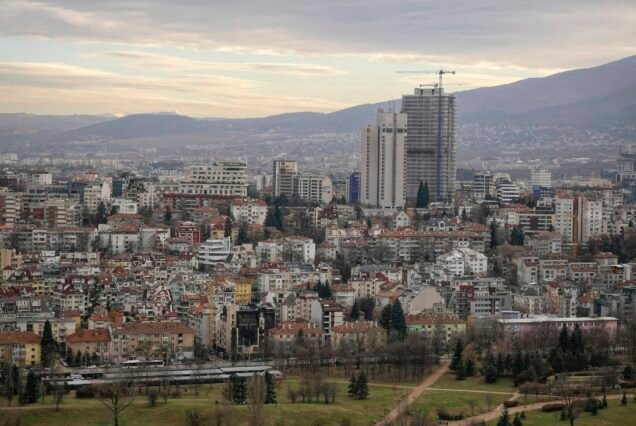 Wide angle aerial view of the center of Sofia with road, houses and trees, Bulgaria