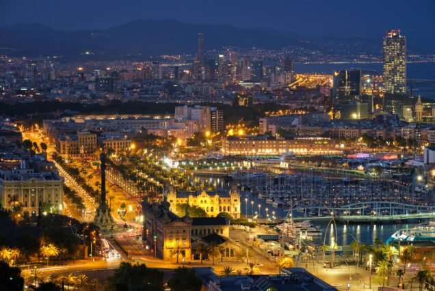 Aerial view of Barcelona city and port with yachts