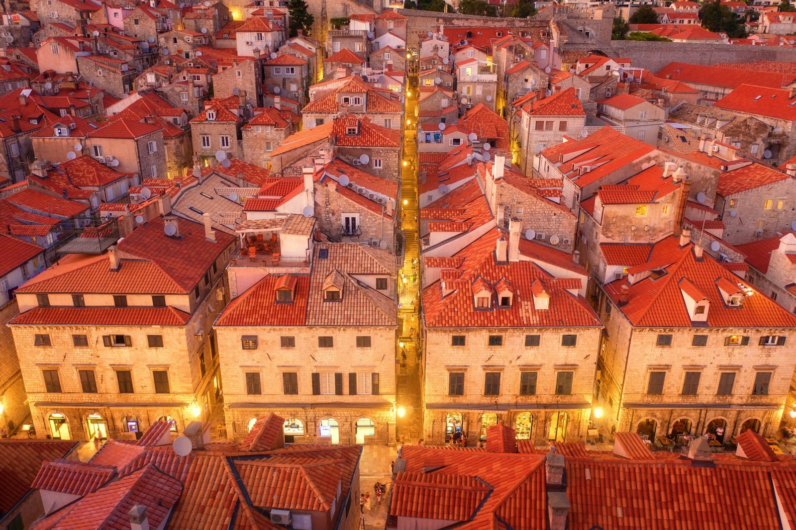 Aerial view of houses with red roofs at night in Dubrovnik