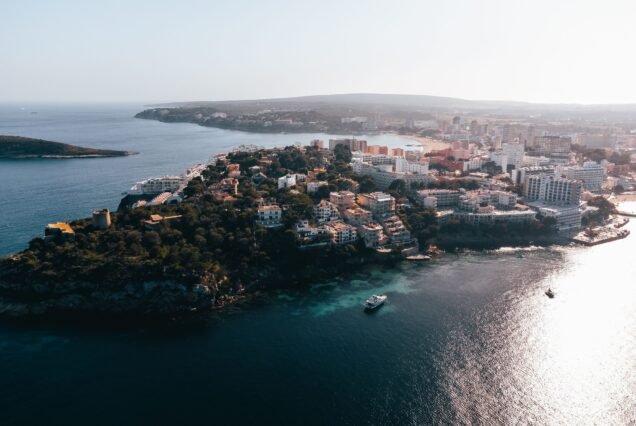 Aerial view of Palmanova Beach in Mallorca, Spain with the city in the background