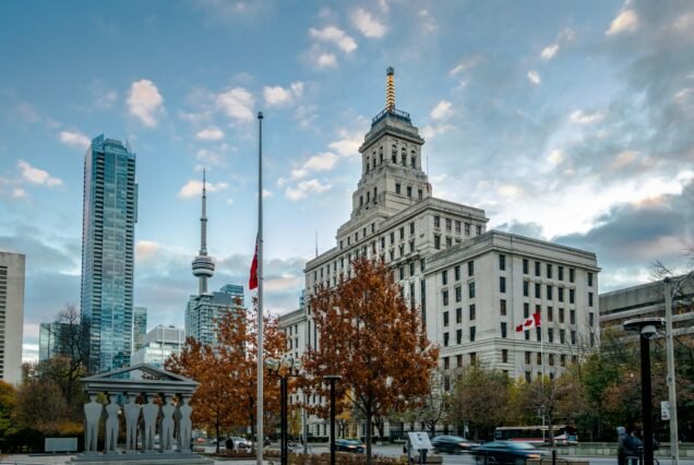 Buildings in Downtown Toronto with CN Tower and Autumn vegetation - Toronto, Ontario, Canada