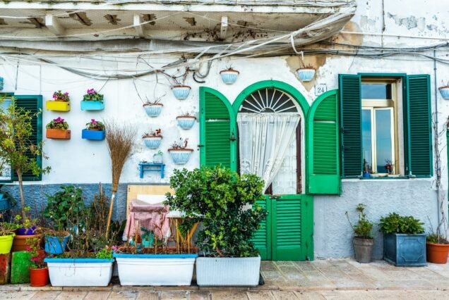 Facades of old Italian Mediterranean houses in Bari painted in colors.