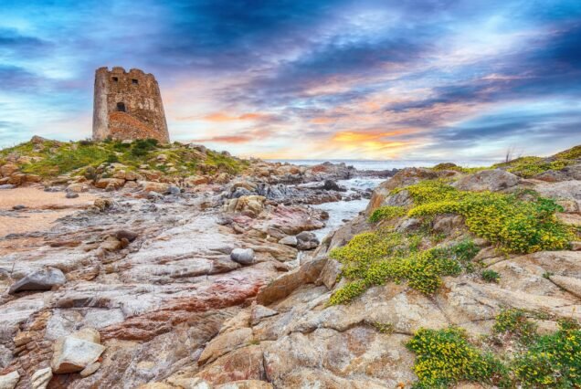 Fantastic sunset view of Bari Sardo tower in the Gulf of Orosei.