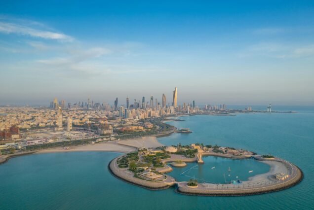 High-angle shot of The Green Island with a skyline of the city of Kuwait in the background