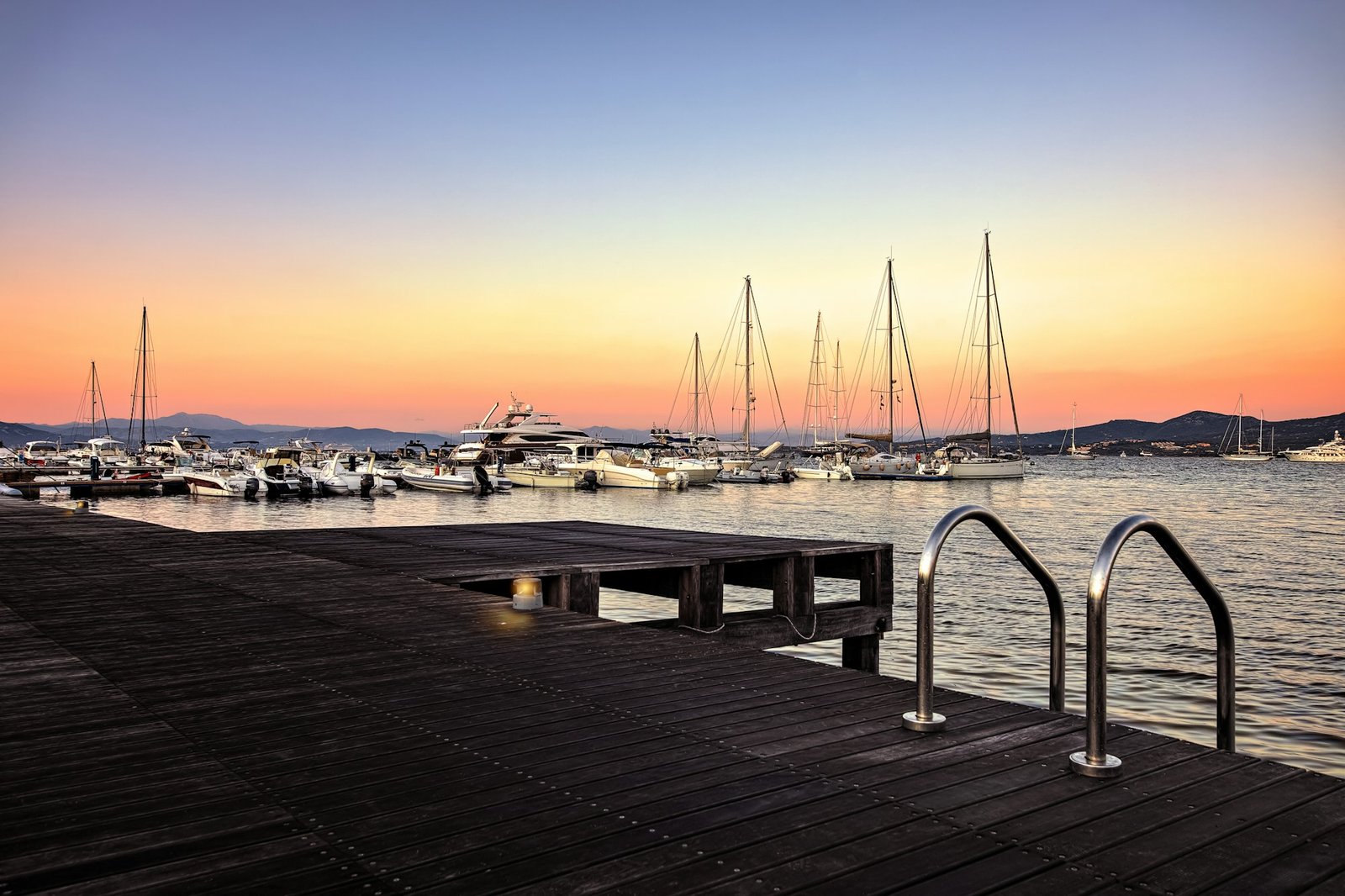 Landscapes from Sardinia by Italy, on the Background the Portisco Harbor