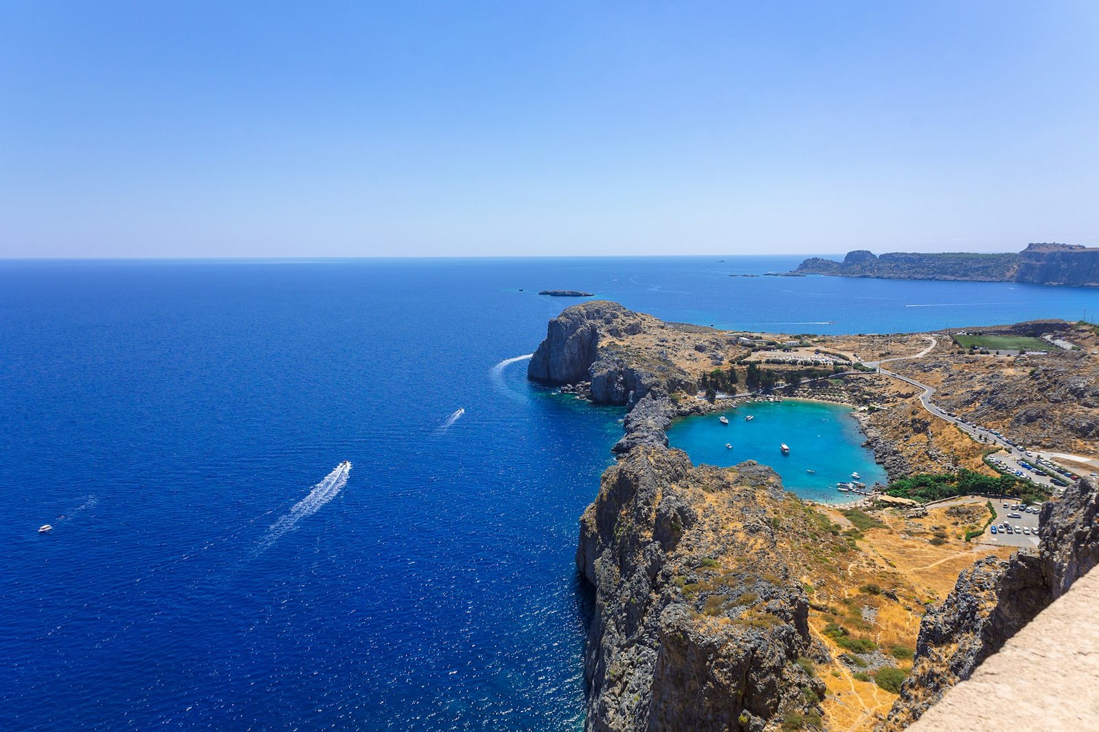 Panoramic view of Saint Pauls Bay in shape of heart from Acropolis of ancient city of Lindos, Rhodes