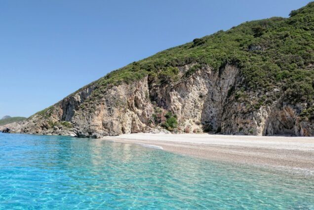 paradise beach of Liapades at Corfu Island (Greece). Sedimentary rock cliff of chalk rocks