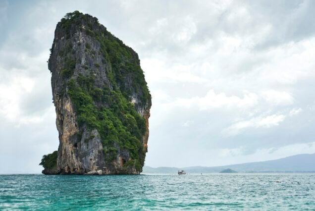 Rock formation protruding from sea, Phuket, Thailand, Asia