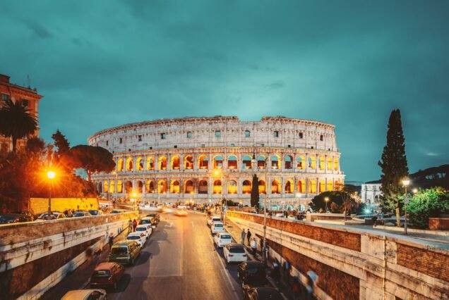 Rome, Italy. Colosseum Also Known As Flavian Amphitheatre In Evening Or Night Time