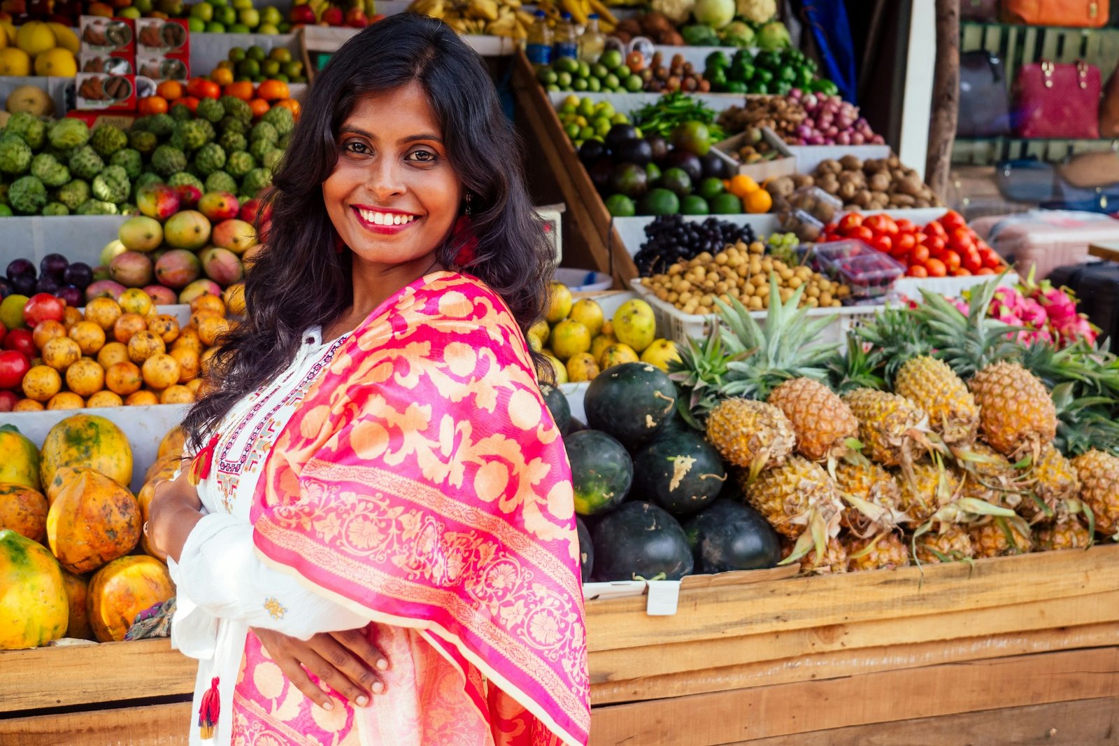travel girl seller in street market and a buyer in a fruit shop in india delhi