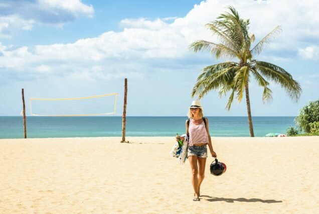 Young woman traveler walking on the beach at island hopping in Phuket