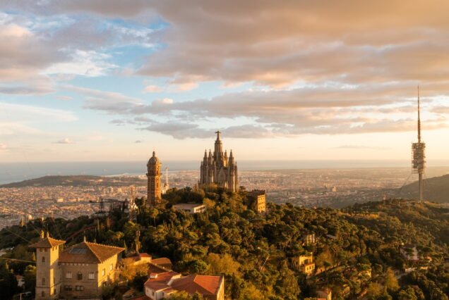 Aerial view of Barcelona skyline with Sagrat Cor temple during sunset, Catalonia, Spain