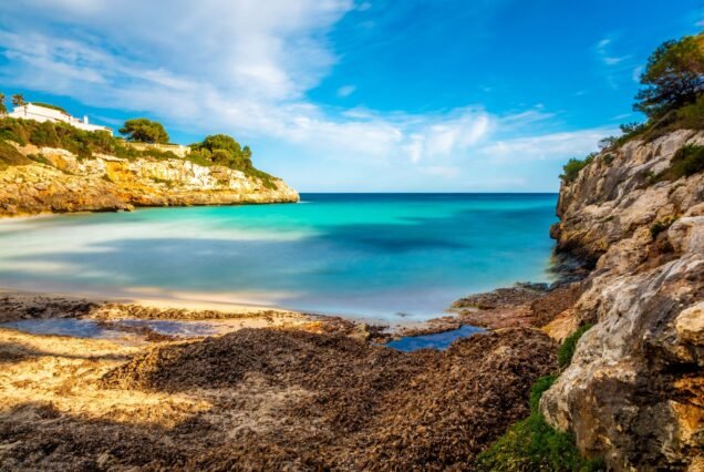 Scenic view of the Mallorca shoreline with crystal blue water, Spain.